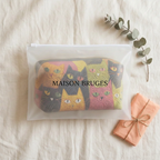 Trousse de maquillage matelassée Jardin des Chats emballée dans une pochette Maison Bruges