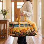 Sac de voyage matelassé Sentiers Classiques porté à la main dans l'entrée