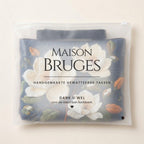 Delicate Magnolia quilted tote bag in its Maison Bruges pouch